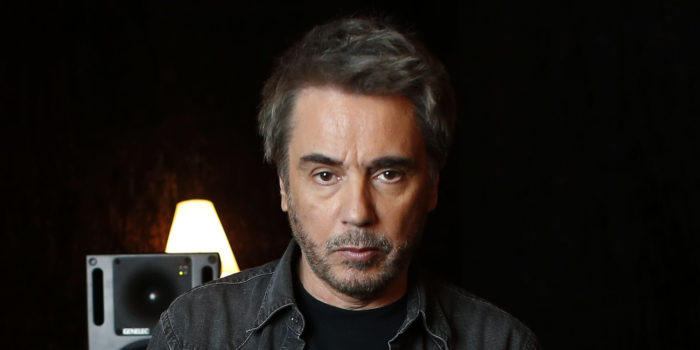 French composer, performer and music producer Jean-Michel Jarre poses at his recording studio in Bougival, west of Paris, on September 30, 2015. AFP PHOTO / THOMAS SAMSON
